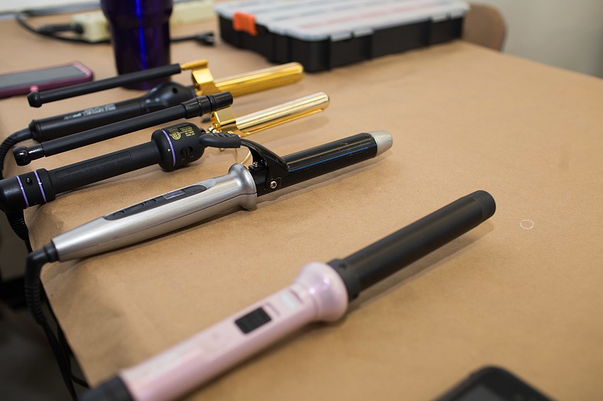 Cutting Loose Salon and Nuovo Salon volunteered their morning to getting the designers ready for the show.