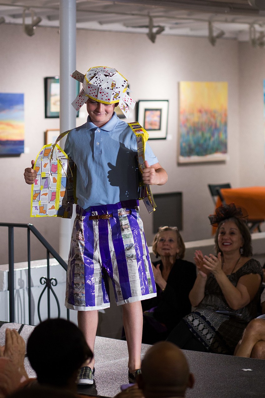 Avery Cole opens the vest on his design, 