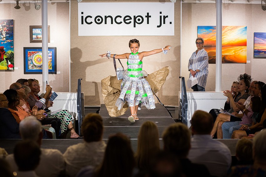 Alexandra Misantone came onto the runway with a paper wrap, which she threw off to reveal her piece, 