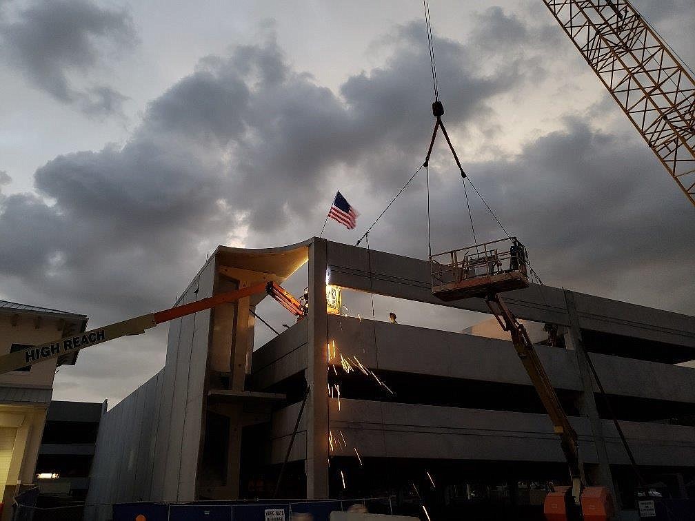 A spandrel, known as the last piece of precast concrete, is being welded on the evening of Sept. 20, 2018.  Photo courtesy of  Lee-En Chung