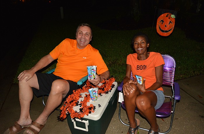 Lakewood Ranch's John Annis and Regina Morris give out juice drinks to trick-or-treaters, which works well for those frequently hot Halloween nights.  Some trick-or-treaters drink them right away.