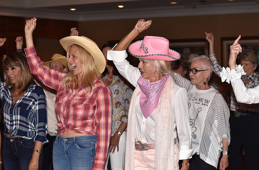 Dancers learn the steps to a line dance for  “Save A Horse (Ride A Cowboy)” by Big & Rich.