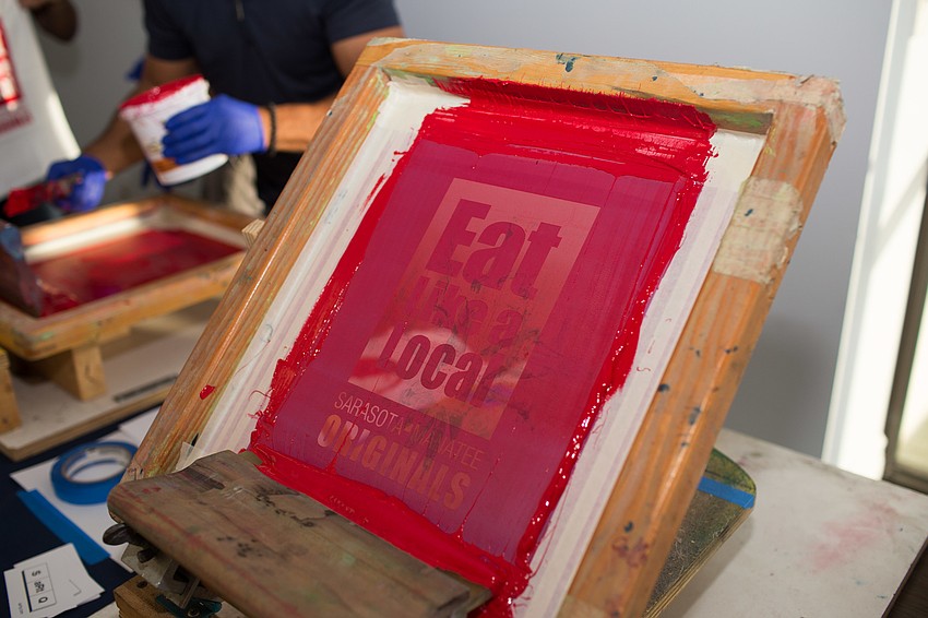 The napkins were painted with the Eat Like a Local logo.