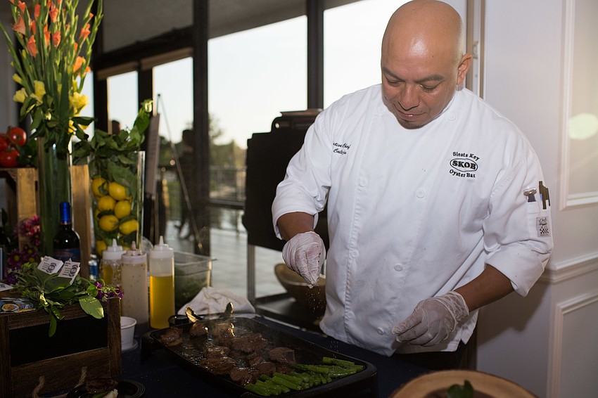 Gino Calleja, executive chef at the Siesta Key Oyster Bar, dusts porcini on his filet mignon.