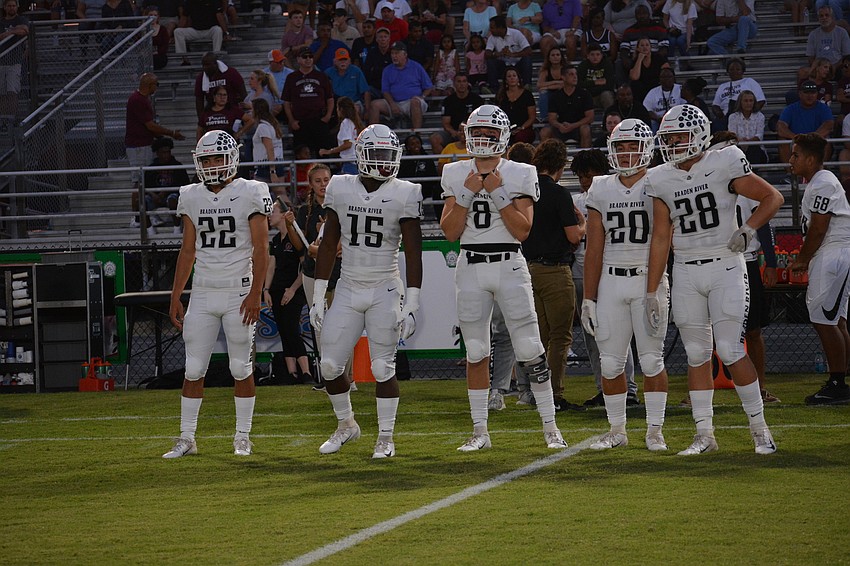 Pirates captains Tyler Navas, Knowledge McDaniel, Bryan Gagg, Taylor Pawelkoski and Travis Tobey await the coin toss.