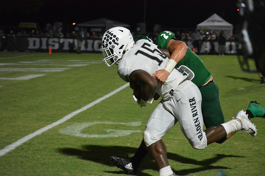 Senior wideout Knowledge McDaniel drives a Venice defender into the end zone for a touchdown.