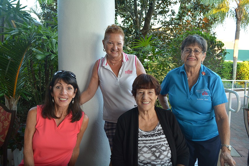 (Left to right) Roe Hyer, Tonya Ditty, Terry Dangel and Joanne DiCarlo check in golfers and make sure they get their meal tickets.