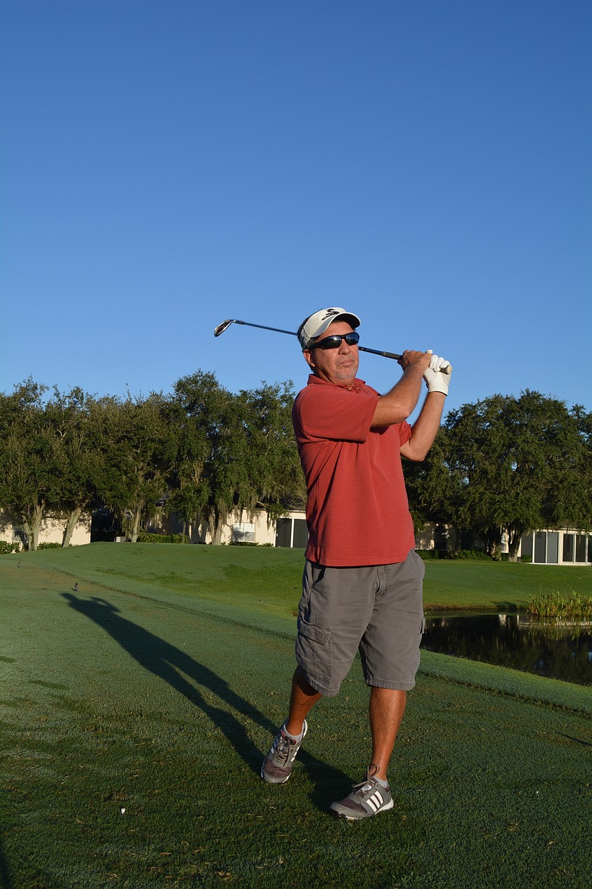 Ron Louder takes the first shot at Hole 17 with friends J.J. Coe, Tom Diem and Joe Kloss, not pictured.