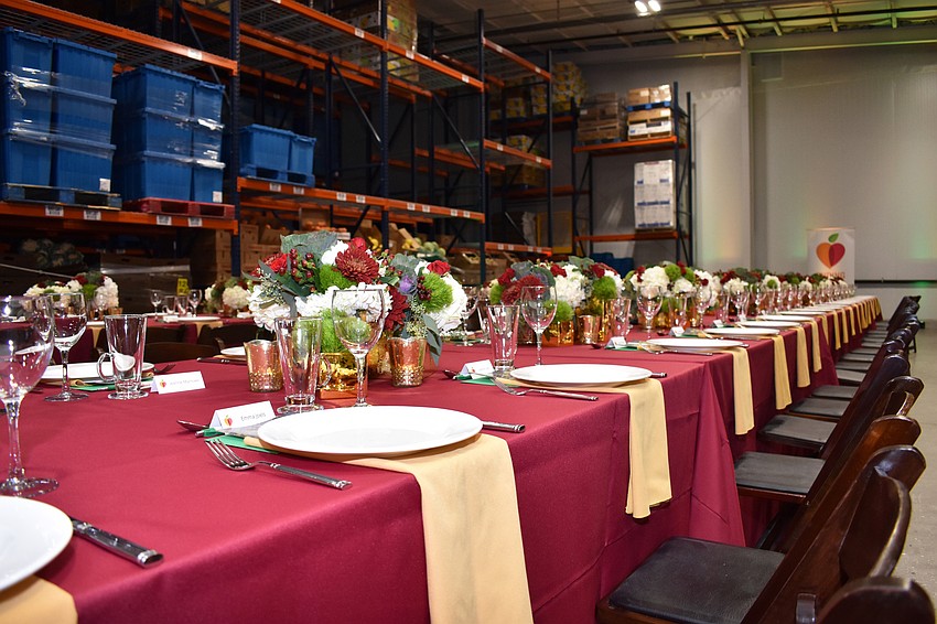 The dinner was held inside the All Faiths Food Bank warehouse.