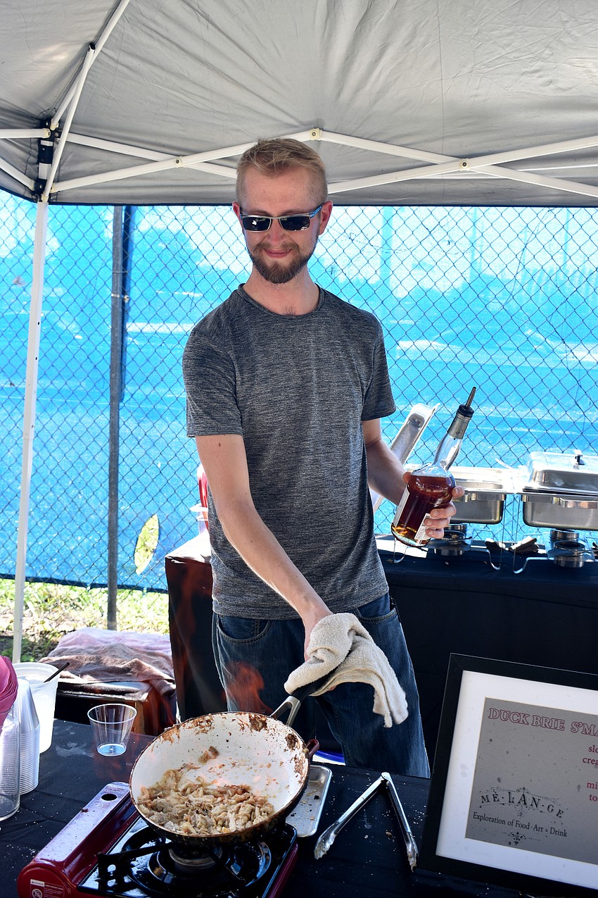 Jess Zellner, the sous chef at Melange, prepares duck for their “Duck Brie S’Mac Down.”