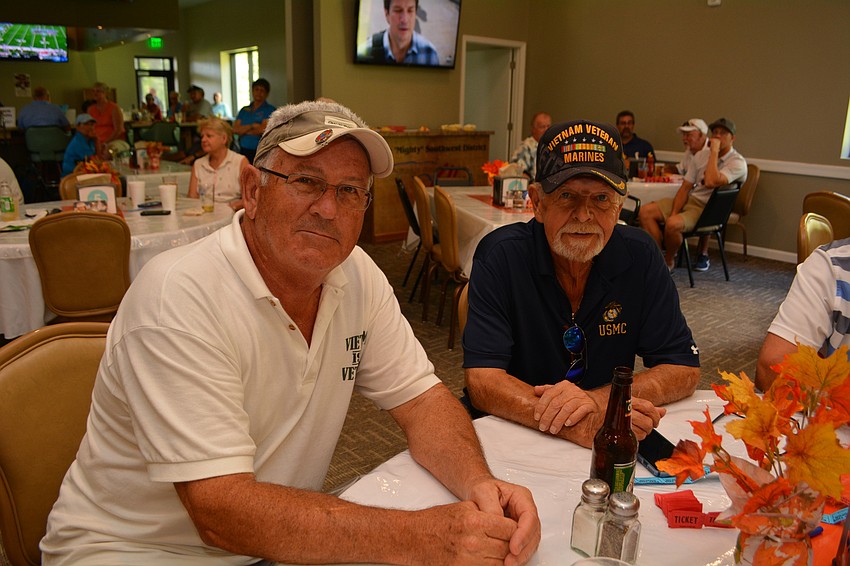 U.S. Marine veterans Tony Torretta and Wayne Carr enjoy lunch after the tournament.