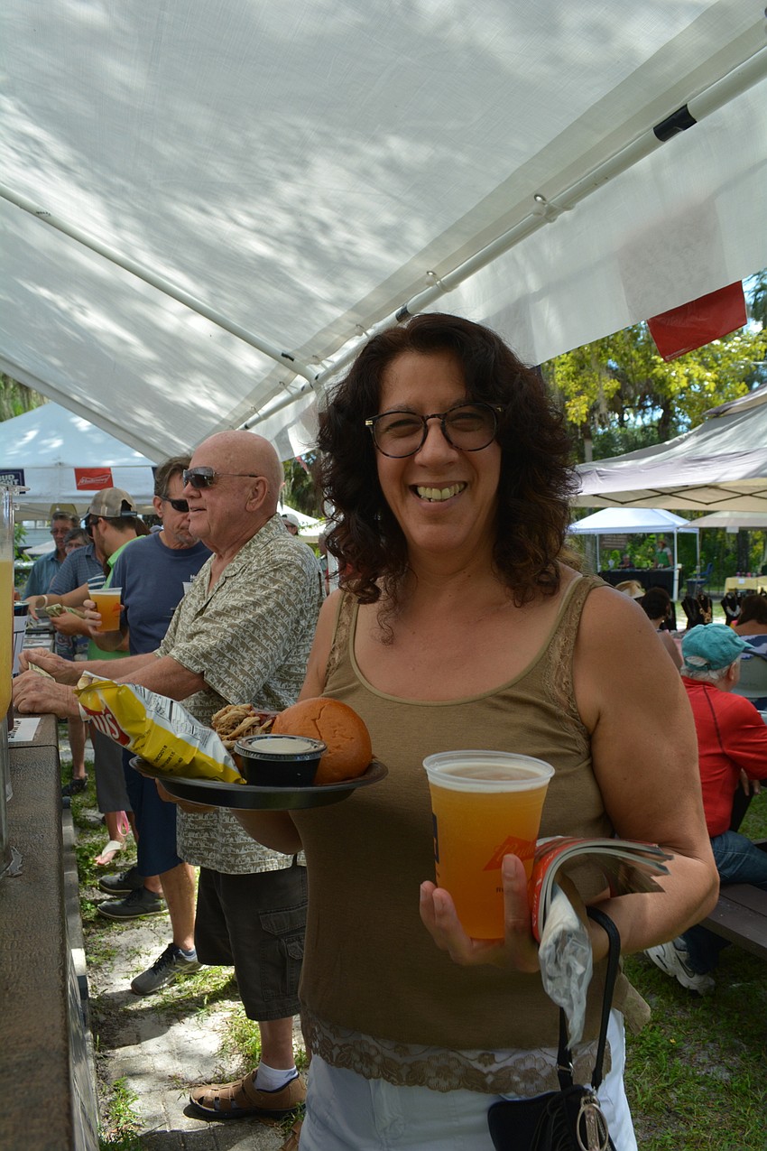 Bradenton's Dina Stewart loads up on barbecue with her husband, Bill, not pictured.