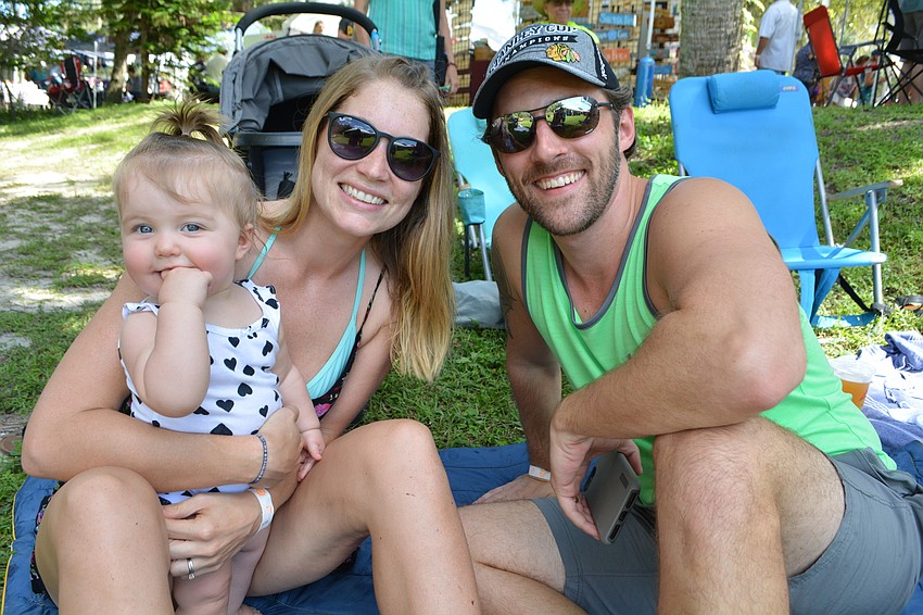 Brittnee and Tony Laughlin, with their 8-month-old Aria, wait for their friends to arrive. They learned about the festival on Facebook.