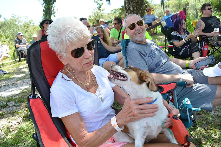 Esplanade's Janet Albright and her husband, Jim Stout, love bluegrass. They even brought their dog, Keeper, for the entertainment.