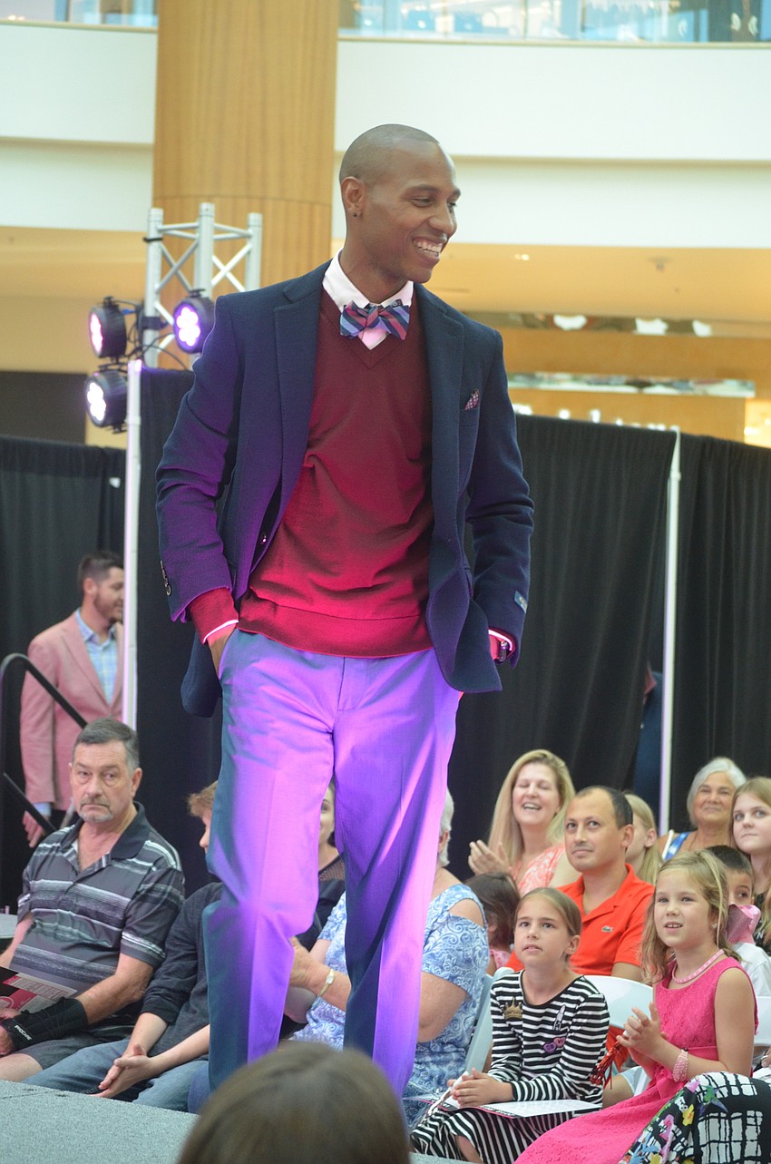 North Port High School principal Brandon Johnson says the fashion show helps him support the cause to find the cure for breast cancer.