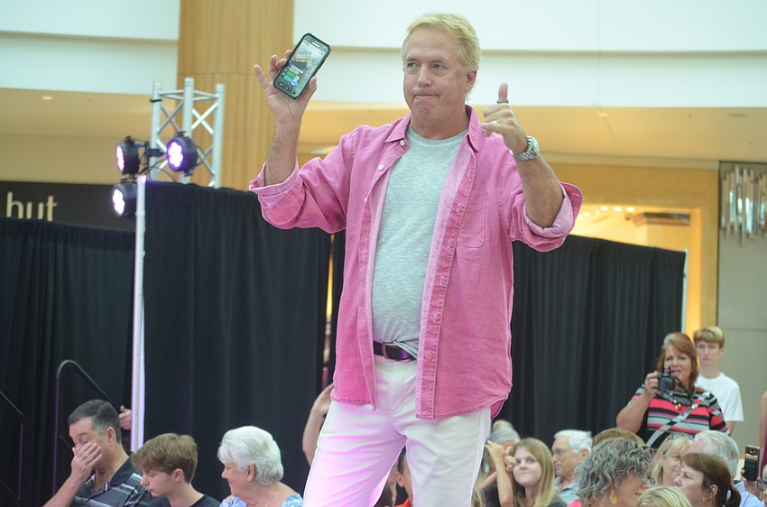 Jimmy Vines, the owner of TapSnap, livestreams his turn down the runway on Facebook.