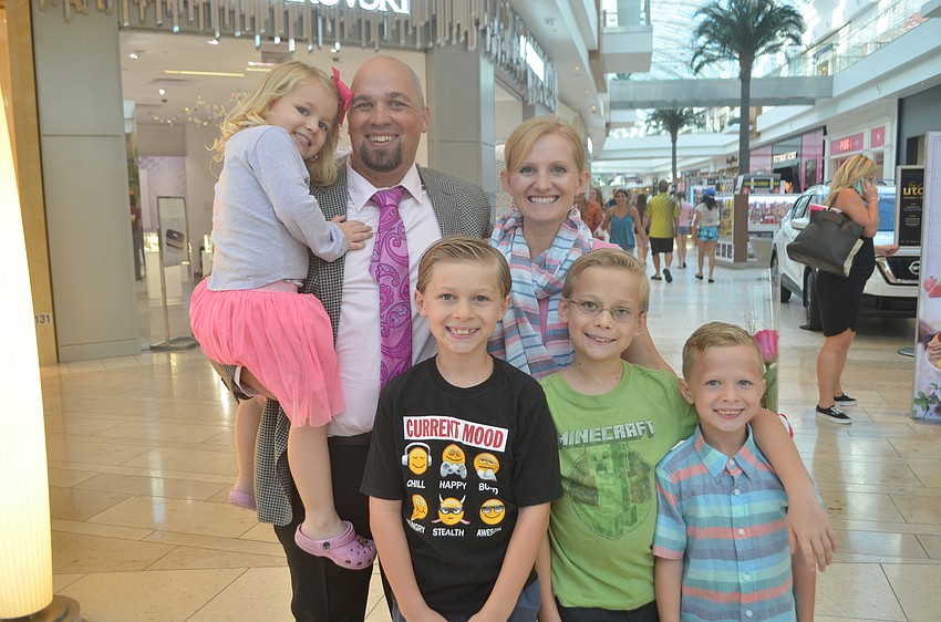 Lakewood Ranch's Elly Hansen, 4, Alan Hansen, Parley Hansen, 9, Allison Hansen, Benjamin Hansen, 11 and Ty Hansen, 7 came out to support the Real Men Wear Pink fashion show.