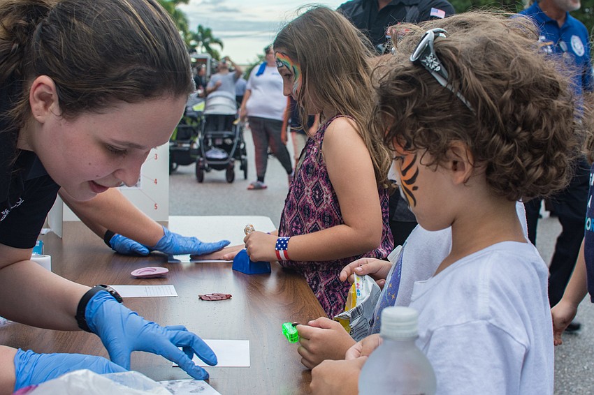 Christian Mauricio gets his fingerprints done.