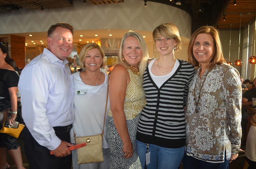 Lakewood Ranch's Jerry Lamb, Sisterhood for Good's Angela Massaro-Fain and Becca Towery with Fellowship of Companies for Christ International's Maria-Francesco Massaro-Fain and Lisa Krouse all assisted in set up for the event.