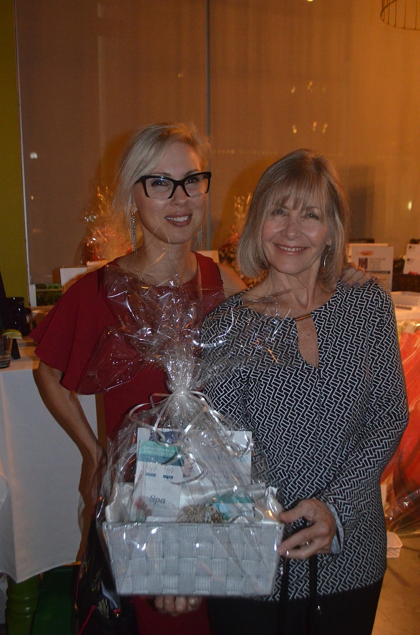 Sirius Day Spa's Karen Medford with new Sisterhood for Good member Kathi Linde, who won a package for a treatment at the Spa donated by Medford.