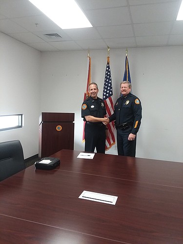 New Longboat police officer John Michael Bobianski with Police Chief Pete Cumming