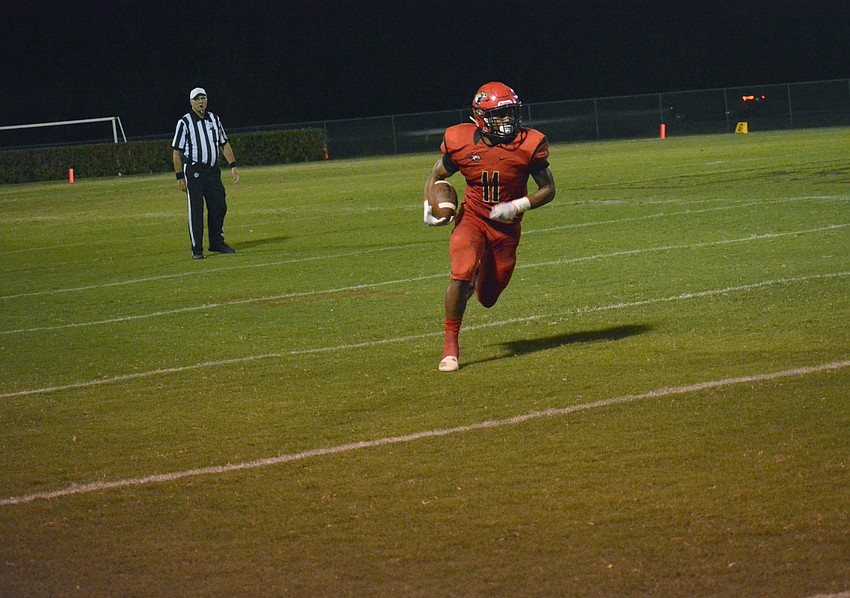Junior running back Tray Hall finds some open field for a big gain on the ground.