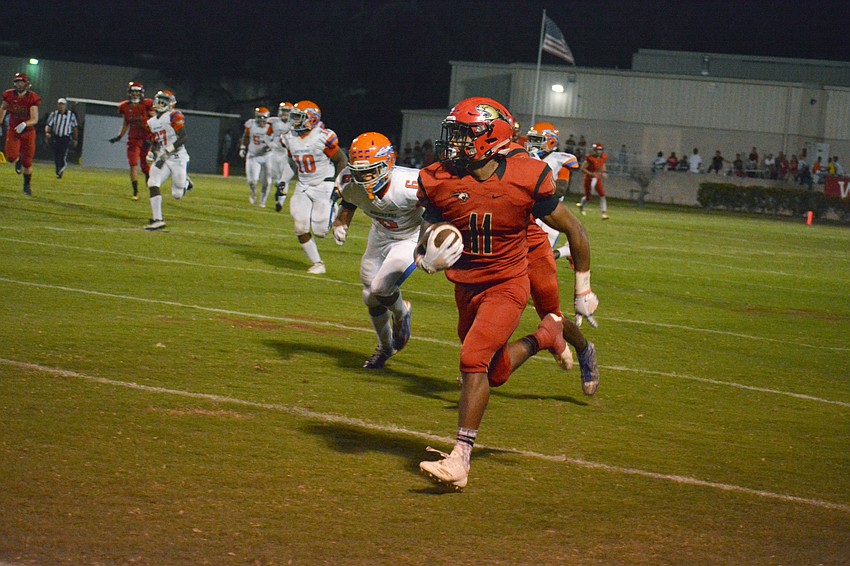 Junior running back Tray Hall busts a big gain down the sideline.