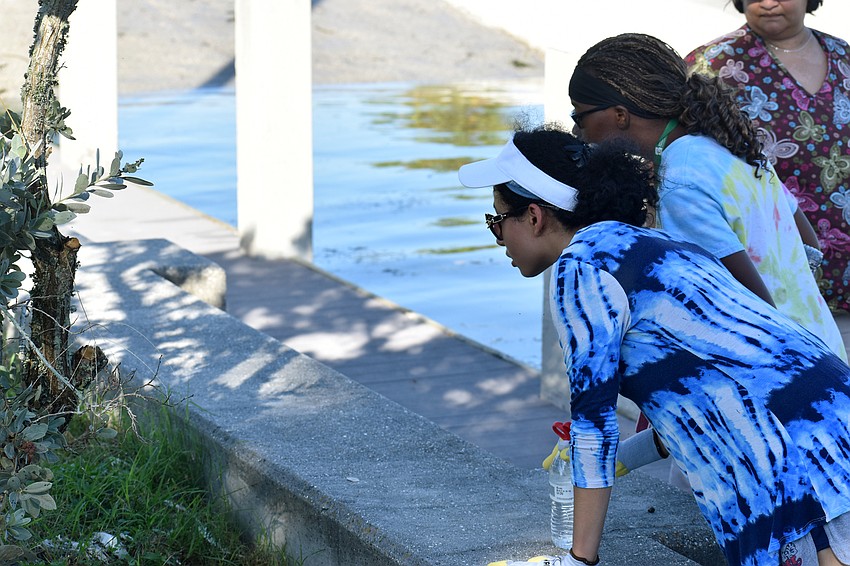 Zyanne Miller and Chloe Manes look for monofilament on City Island.