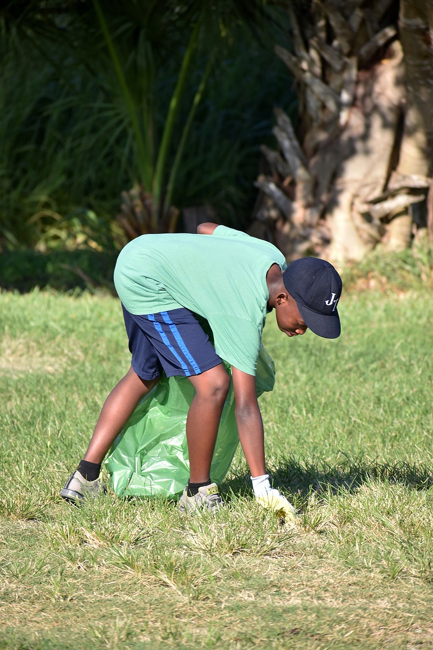 Jason Miller picks up trash on City Island.