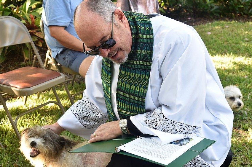 The Rev. Kenneth Blyth blesses Jacob.