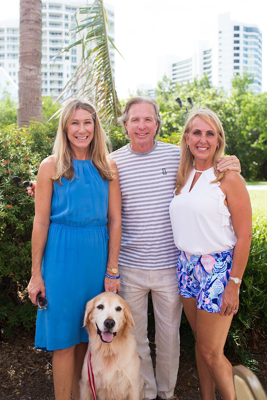 Co-chairs Janet Walter with her dog, Buck, Ron Soto and Becky Sirigotis.