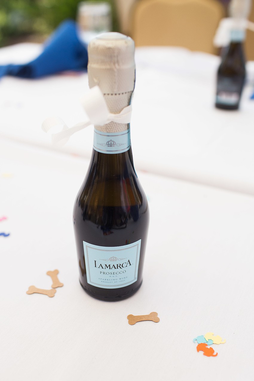 Mini bottles of prosecco sat on the tables.
