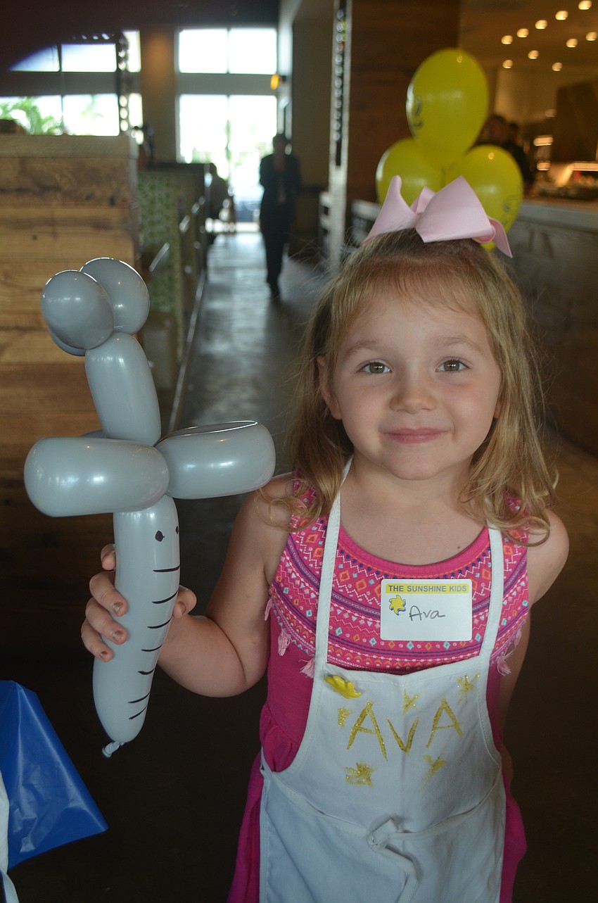 Bradenton's Ava Luciano, 4, painted on an apron that she got to wear while she made her pizza.
