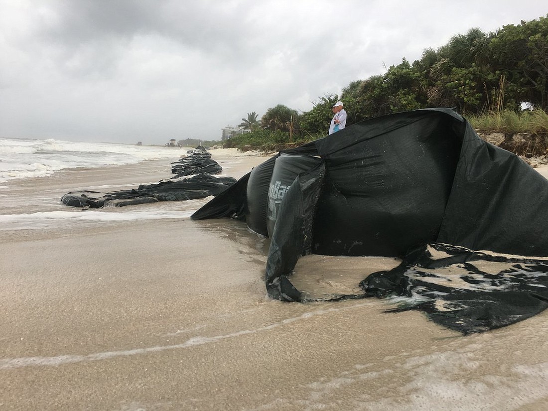 Waves and high tides wiped out the sand from a series of bags posted along the Lido Key shoreline. Photo courtesy city of Sarasota.