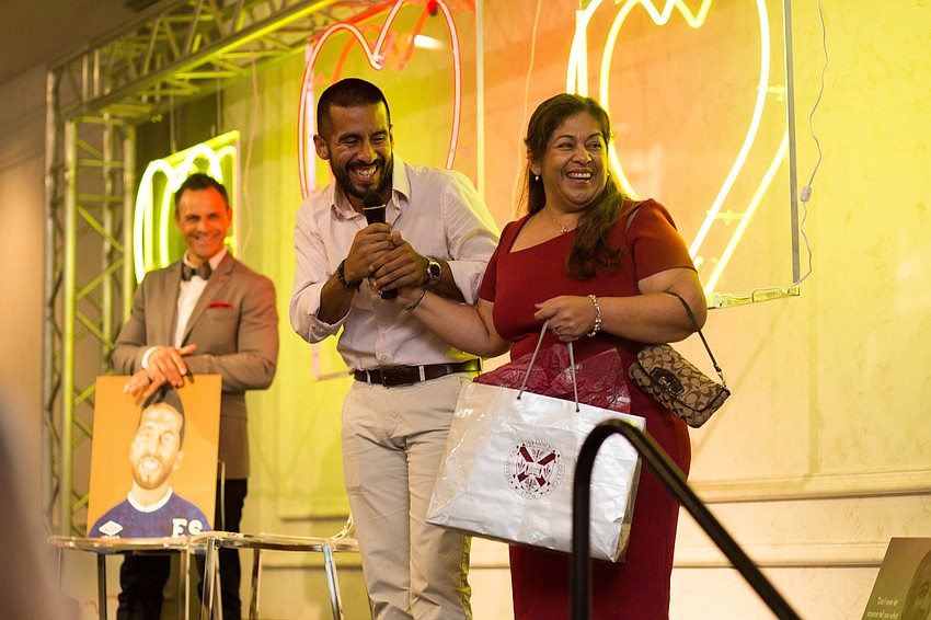 Diego Velasco and his mother, Ester Orellana smile at Diego's fiancé, Juliette Chero.