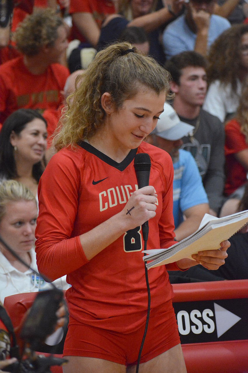 Cardinal Mooney junior Sophia Hritz reads a speech dedicated to Cougars senior Dalton Judge.