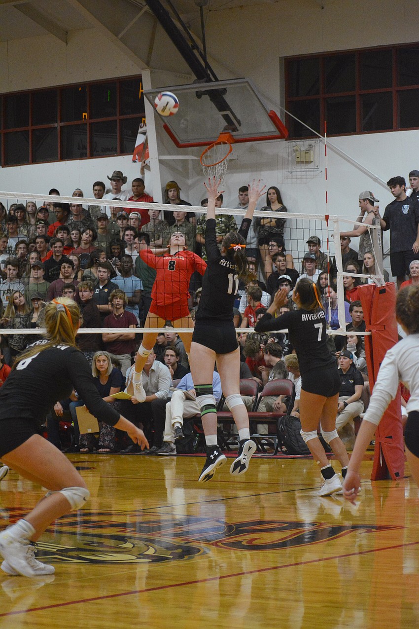Sophia Hritz (8) skies for a kill against Riverview.