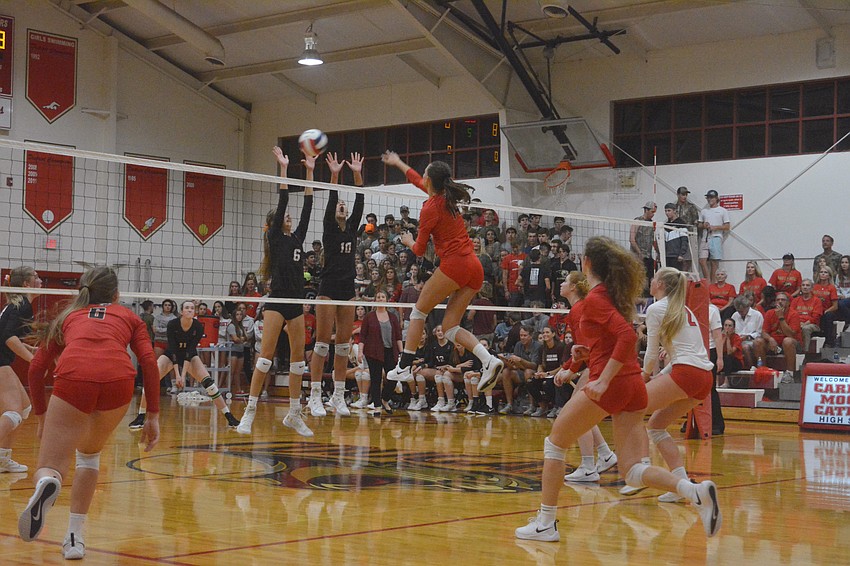 Sophomore Skye Ekes (14) fires a shot past Riverview defenders for a point.