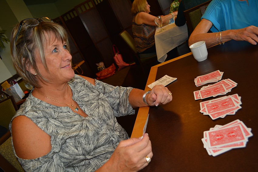 Maurren Gault plays canasta for the first time.