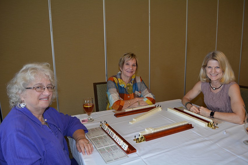 Beryl Bosher, Janet Mamane and Patti Sue Peotter-Bettes select mahjongg for the day.