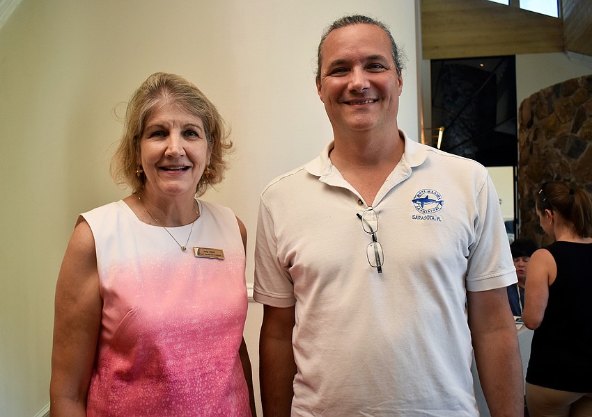Event host and Michael Saunders & Company Realtor Julie Klick and Mote Marine Laboratory Scientist Vincent Lovko