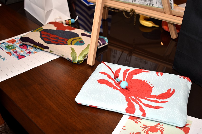 Raffle prizes, such as these handmade clutches, lined a table. Proceeds from the raffle went to Mote Marine Laboratory.