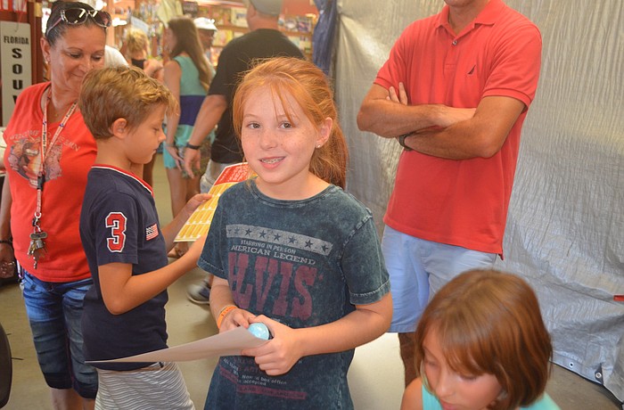 Molly Neary got to hold some of the items that her team bargained for, including a blue bath bomb that she ended up getting for free.