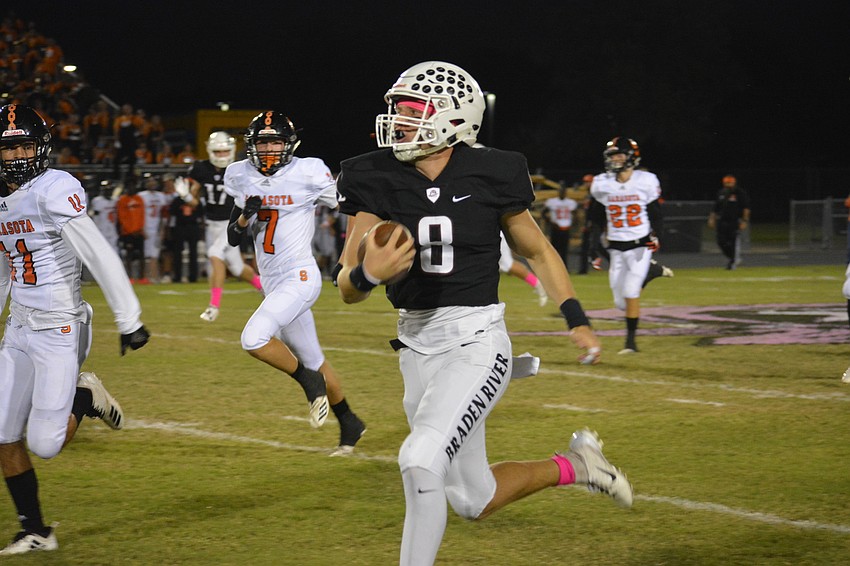 Pirates senior QB Bryan Gagg races down the sideline. Gagg had two touchdown passes in limited action against Sarasota.