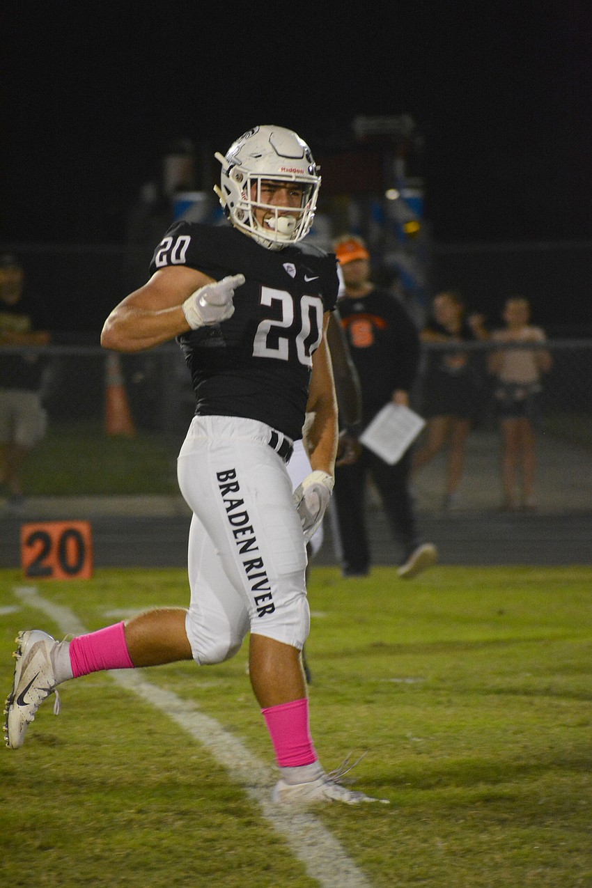 Pirates senior linebacker Taylor Pawelkoski celebrates after a tackle for loss in the first quarter.