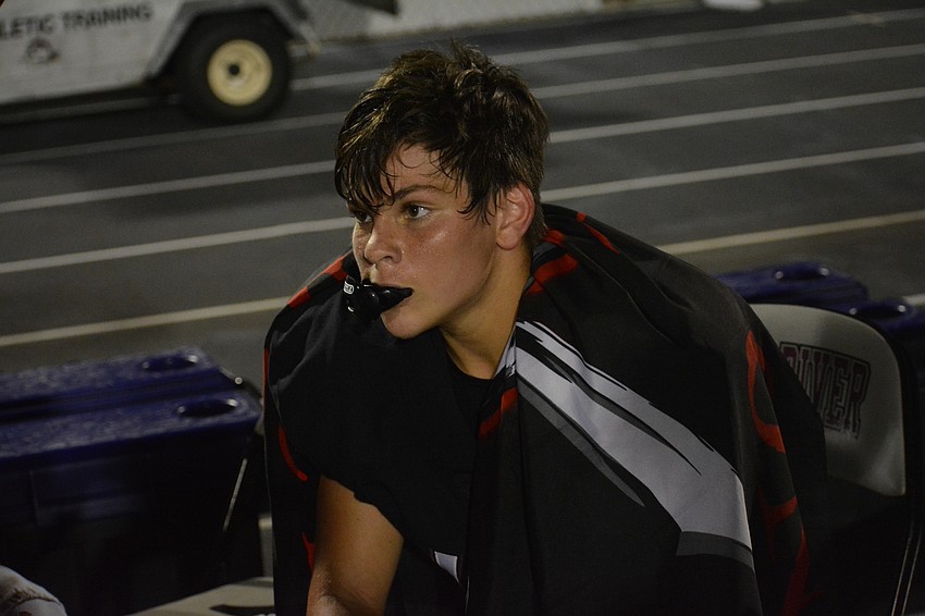 Justin Shofter wears the Pirates' turnover flag after picking off a Sarasota pass.