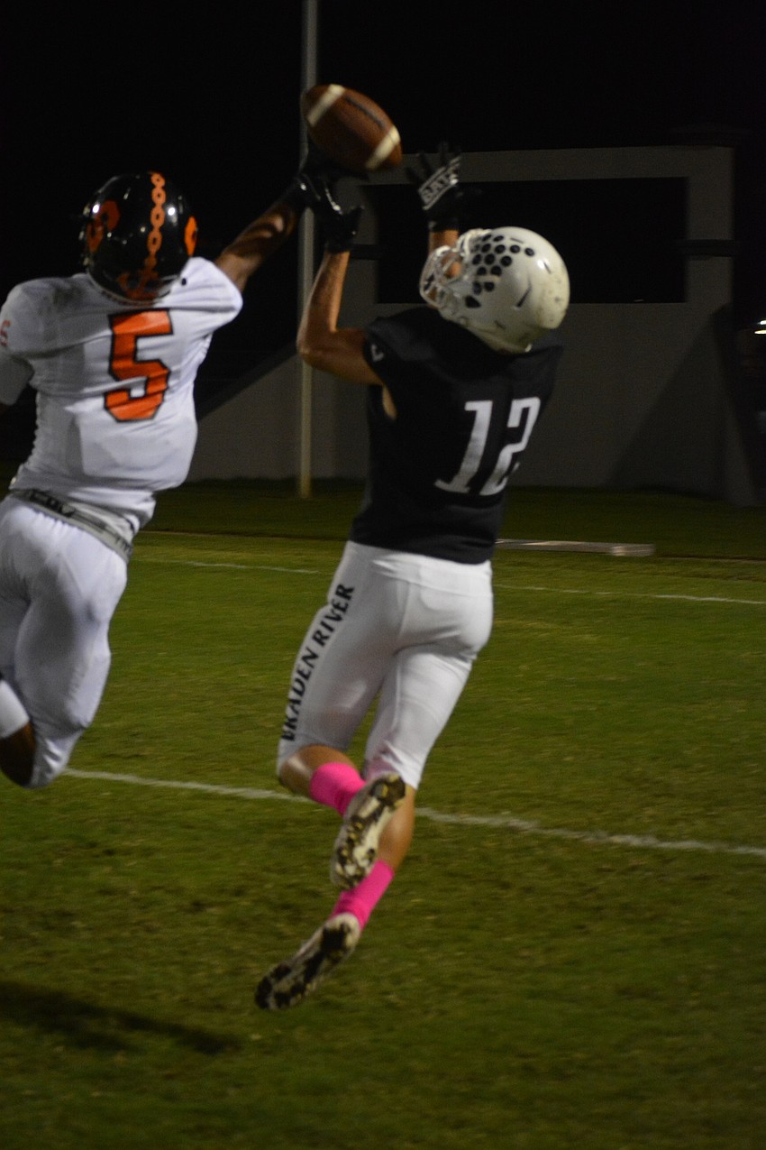 Sailors junior defensive back KJ Clayton knocks a pass away from Pirates senior wideout Jack Milner. Milner would add a 70-yard touchdown catch from  sophomore QB Shawqi Itraish.