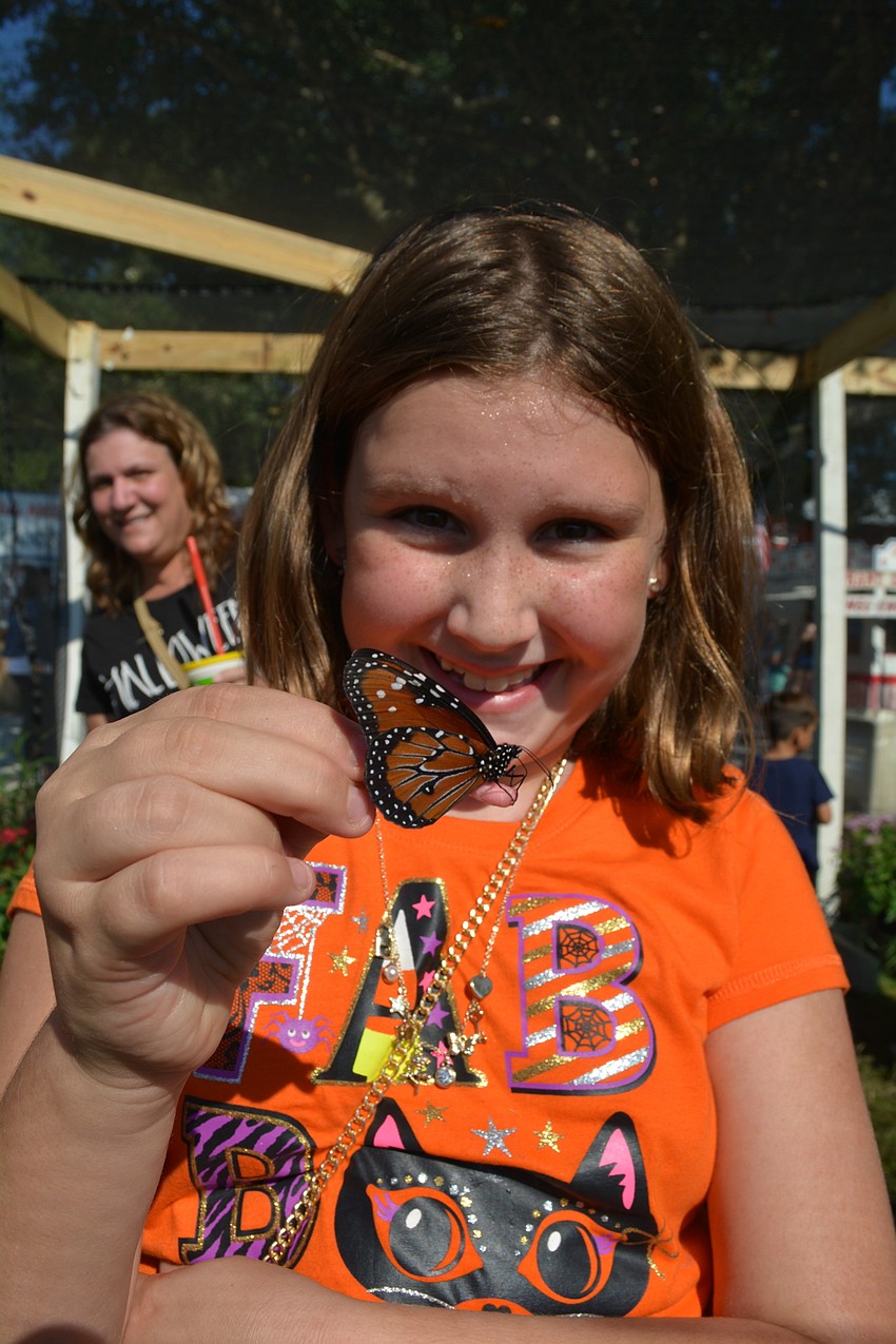 Mill Creek 10-year-old Grace Gerling has fun catching butterflies with her sister, Lilly, not pictured.
