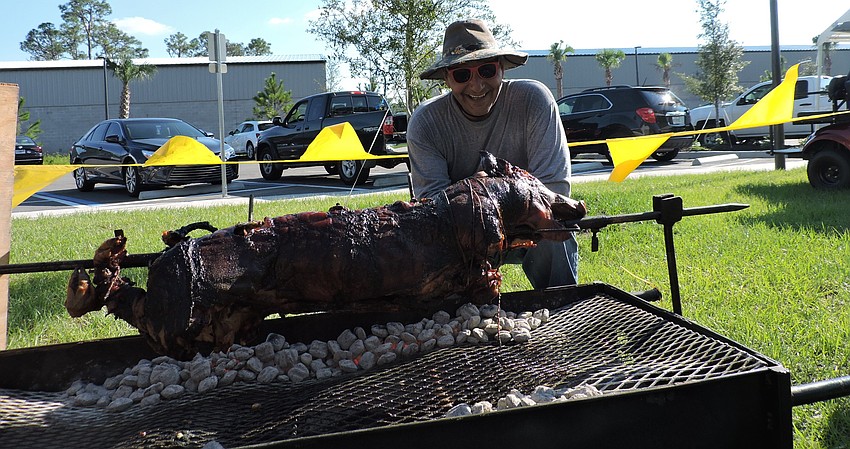 Lakewood Ranch's Matt Farhat, a financial advisor who is an Elk, donated his time and the use of his equipment to roast a pig.