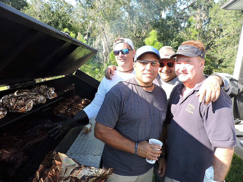 Chuck Reda, Bill Earl, Matt Farhat and Rick Browning were volunteers who began cooking at 5 a.m. for the evening event.